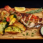 Морський окунь на вогні